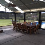 8 person dining table in alfresco area with patio blinds